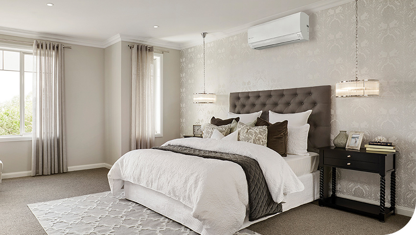 Photo of a bedroom with heat pump on wall