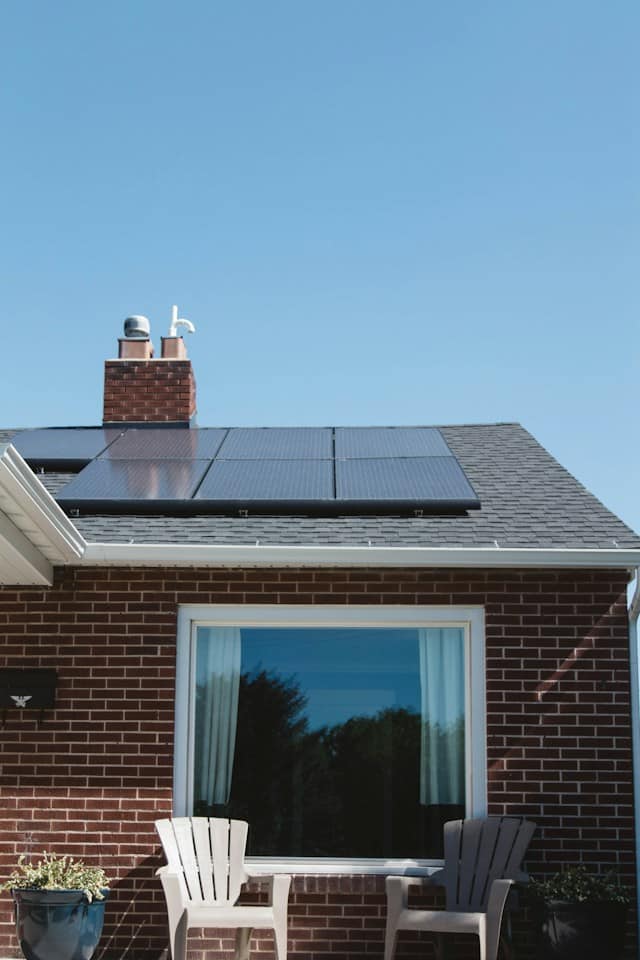 Photo of house with solar panels on roof